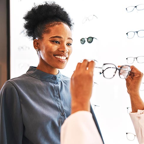 Woman selecting prescription eyeglasses