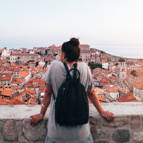 female traveller looking out over an italian village