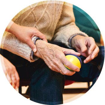 elderly person recieving physical therapy.
