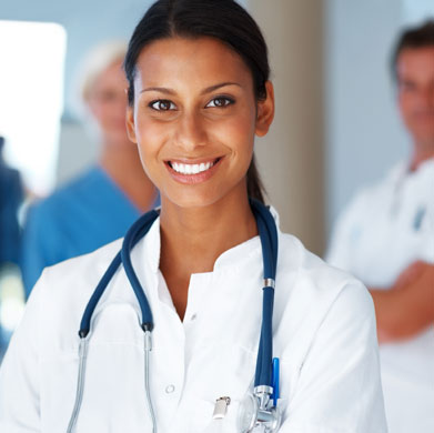 Female Doctor looking at the camera and smiling