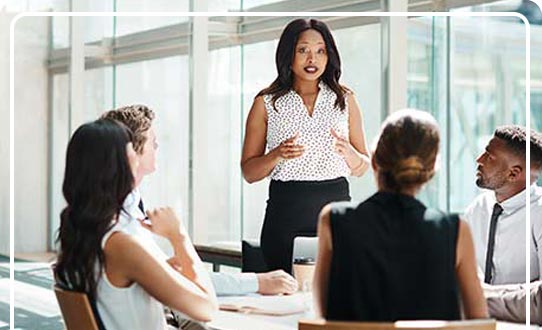 A group of corporate executives in a board meeting