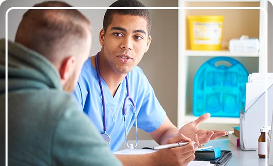 Physician talking with patient
