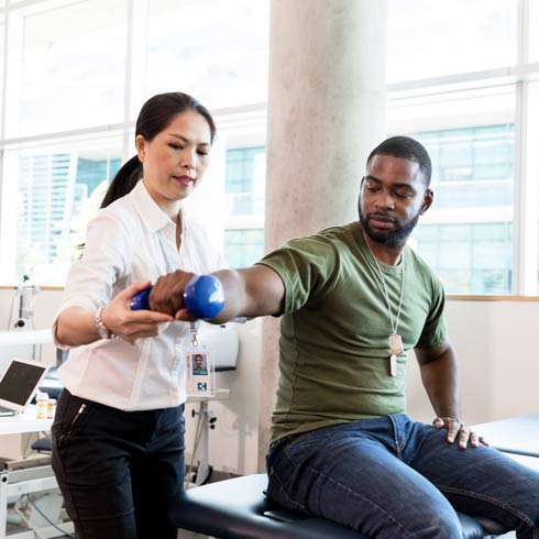 man being treated by a female therapist